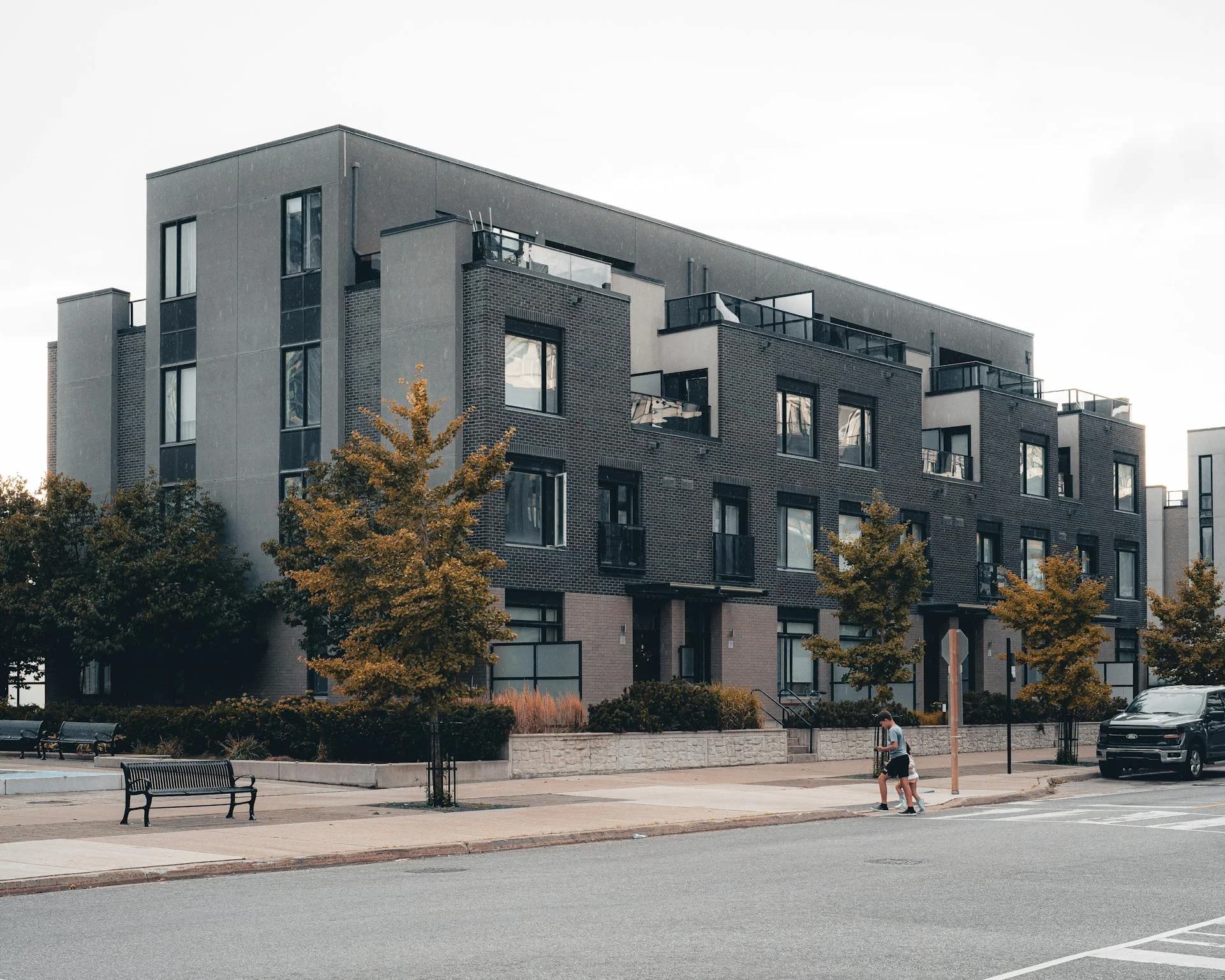 Modern urban apartment buildings on tree-lined street in Mississauga Ontario