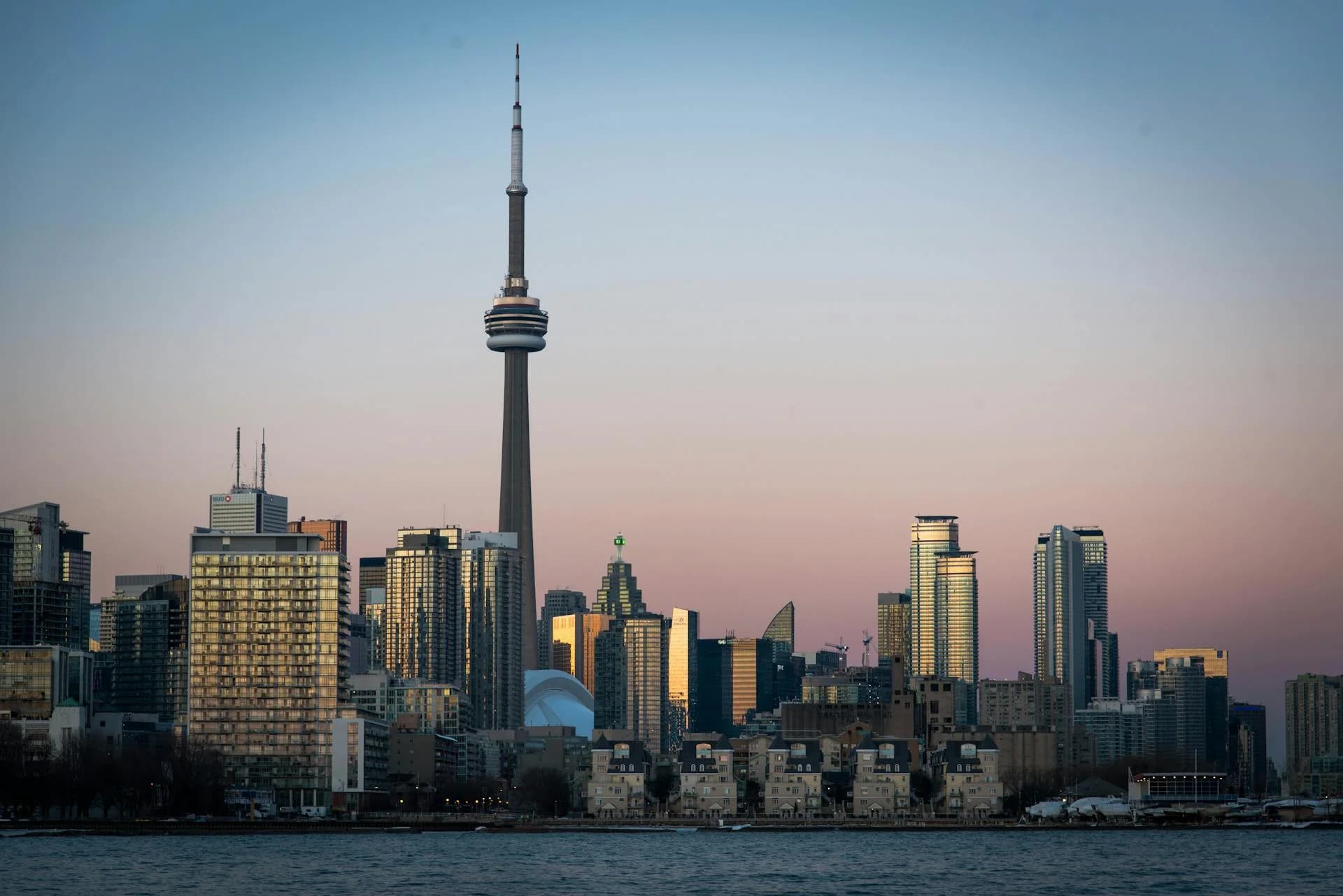 Toronto skyline featuring CN Tower at dusk viewed from North York